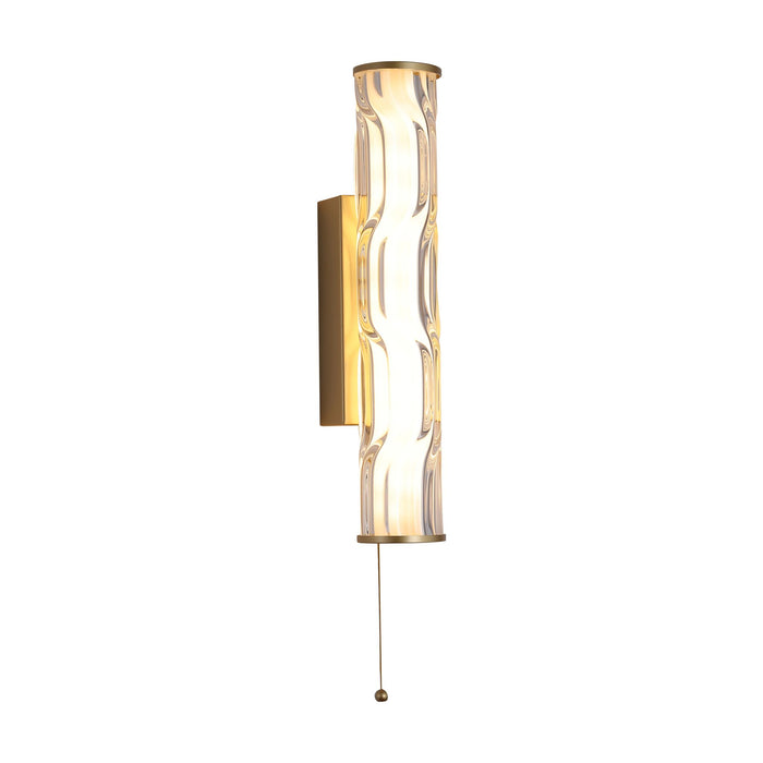 Vibrate matt gold IP44 bathroom wall light glowing behind a rippled clear glass tube with pull cord