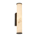 Wales matt black LED wall light glowing through a tall marble-effect resin tube shade